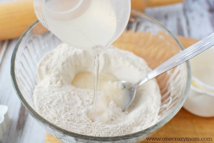 Make special memories with this simple and fun Salt Dough Ornament Recipe for Christmas. Learn how to make salt dough ornaments so easy the entire family can help! This great ornament DIY is perfect for kids. #onecrazymom #christmasornaments #DIYornaments #saltdoughornaments Flour in a bowl.