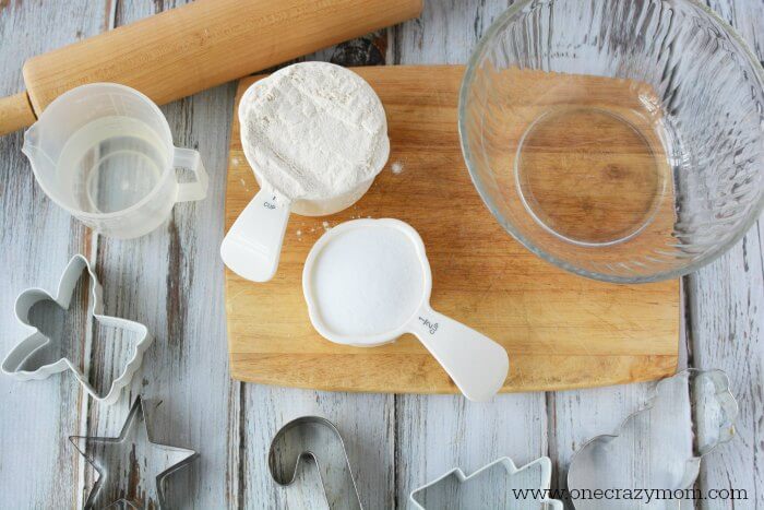 Make special memories with this simple and fun Salt Dough Ornament Recipe for Christmas. Learn how to make salt dough ornaments so easy the entire family can help! This great ornament DIY is perfect for kids. #onecrazymom #christmasornaments #DIYornaments #saltdoughornaments Supplies for ornaments.