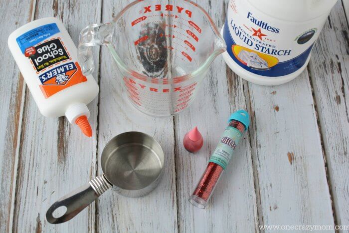 Make this easy Valentines day slime recipe with your kids. They will love Valentine's Day Homemade Slime. Slime is a fun alternative to Valentine's candy. Ingredients for Valentine Slime - glue, water, liquid starch, pink food coloring and red glitter.