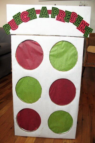 Find Easy Christmas ideas for families here. 20 Fun Christmas activities ideas for kids or toddlers from crafts to games that kids will love. Christmas activities to keep them busy. These are perfect for the classroom too! #onecrazymom #christmasactivities #kidactivities Punch a present game standing.