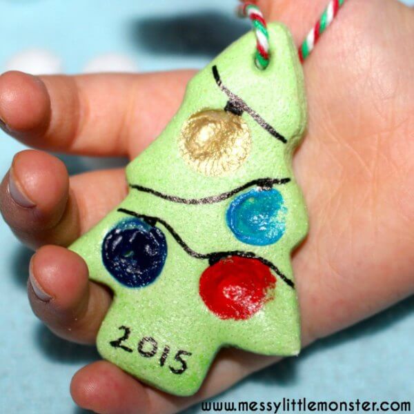 Find Easy Christmas ideas for families here. 20 Fun Christmas activities ideas for kids or toddlers from crafts to games that kids will love. Christmas activities to keep them busy. These are perfect for the classroom too! #onecrazymom #christmasactivities #kidactivities Salt dough ornament in hand.