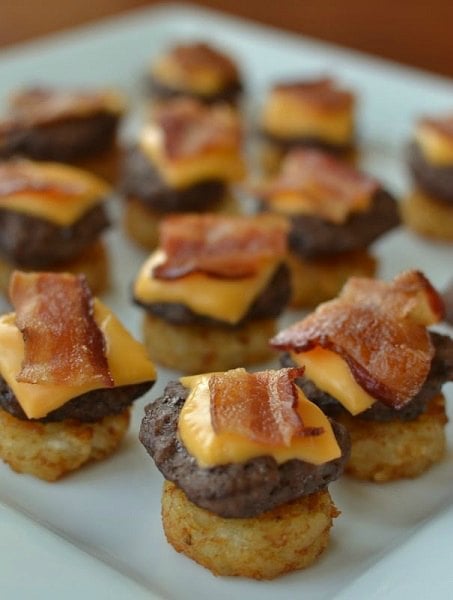 Find the best Super Bowl Snacks kids will love. 25 Easy Superbowl Snacks to please a crowd. Try this Super Bowl Party Food. Super Bowl Party Ideas for kids. Mini cheeseburger bites on plate.