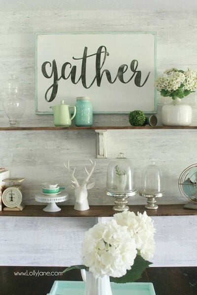 We have over 20 DIY Farmhouse decor ideas that are easy to make. Find lots of ideas that are budget friendly and simple to create for your home. Farmhouse shelves on wall with decor.