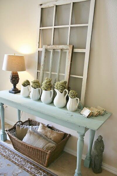 We have over 20 DIY Farmhouse decor ideas that are easy to make. Find lots of ideas that are budget friendly and simple to create for your home. Entry way table with vases.