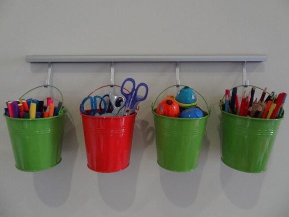 Get your home in order with Dollar Store Home Organization Ideas. 20 creative ways to make the most of your space with Dollar Store home organization. Hanging baskets with crayons.