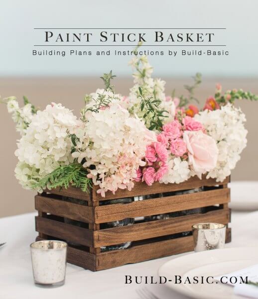 We have over 20 DIY Farmhouse decor ideas that are easy to make. Find lots of ideas that are budget friendly and simple to create for your home. paint stick basket with flowers on table.