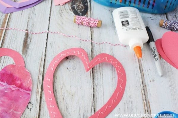 Let the kids make homemade suncatchers for the perfect Valentine's Day Craft. They will love this heart suncatcher and it's so simple to make. Let the kids make homemade suncatchers for the perfect Valentine's Day Craft. They will love this heart suncatcher and it's so simple to make.
