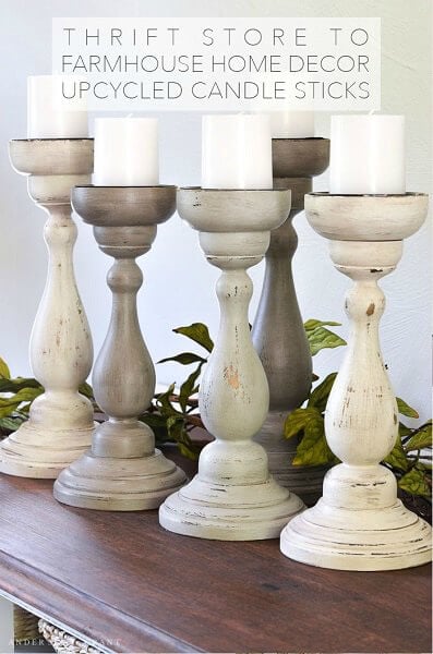 We have over 20 DIY Farmhouse decor ideas that are easy to make. Find lots of ideas that are budget friendly and simple to create for your home. Candlesticks arranged on a table.