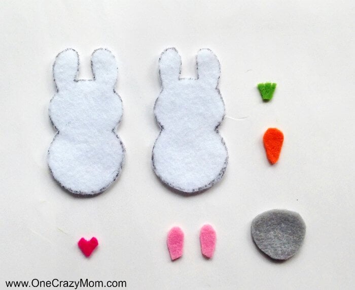 Easter felt crafts are so fun! Learn how to make a Bunny Charm. DIY Easter crafts are so simple. Kids will love this easy bunny craft! Find Easter craft ideas for kids. Easter crafts for kids they will love! Easter bunny and decorations cut out in felt.