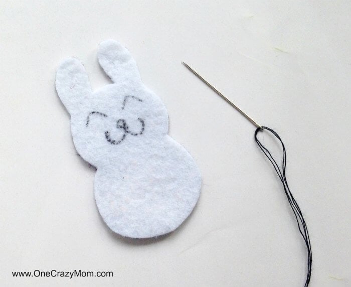 Easter felt crafts are so fun! Learn how to make a Bunny Charm. DIY Easter crafts are so simple. Kids will love this easy bunny craft! Find Easter craft ideas for kids. Easter crafts for kids they will love! Bunny template with face drawn.