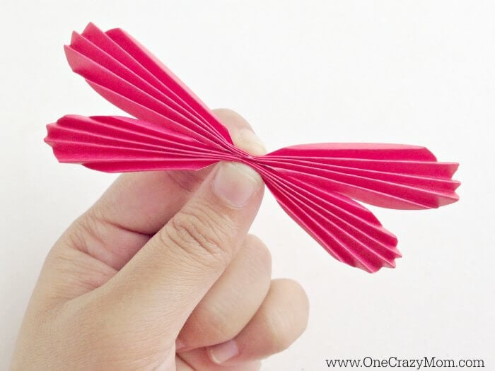 Make this fun butterfly craft for kids! DIY Butterfly Wall Art is so whimsical. Kid's will love making this DIY Paper Butterfly. Easy Paper Butterfly Craft for Kids is fun and easy! Hand pinching butterfly wings.