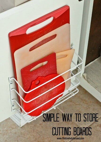 You will love these Dollar Store Kitchen Organization ideas! 20 Kitchen Organization hacks to get your kitchen in order for just a $1! You can't beat that! Cutting boards stored on wire organizers.