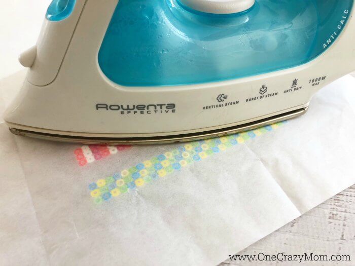 Ironing beads to fuse the beads. 