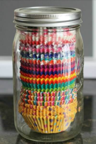 You will love these Dollar Store Kitchen Organization ideas! 20 Kitchen Organization hacks to get your kitchen in order for just a $1! You can't beat that! Cupcake liners in a jar.