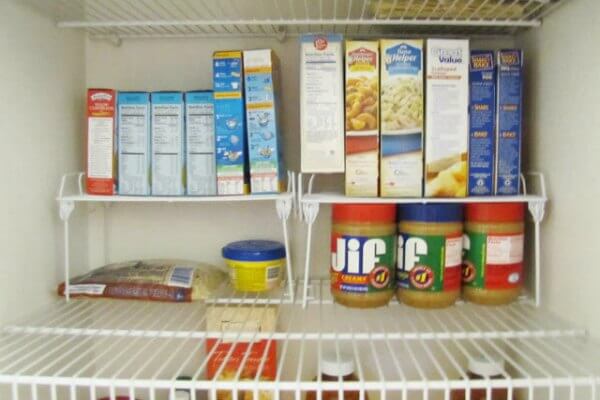 You will love these Dollar Store Kitchen Organization ideas! 20 Kitchen Organization hacks to get your kitchen in order for just a $1! You can't beat that! Boxes of items on wire racks.