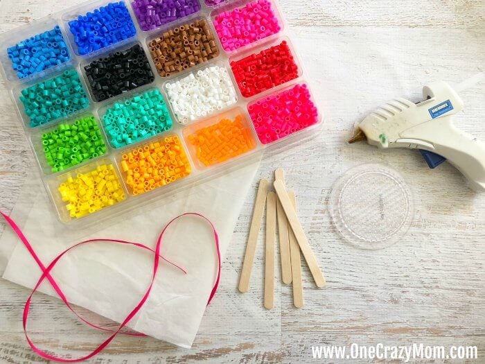 Perler beads are so fun and this Lollipop Perler Beads Craft is the perfect activity for the kids. This craft idea is simple and frugal but a blast to make! Perler beads are so fun and this Lollipop Perler Beads Craft is the perfect activity for the kids. This craft idea is simple and frugal but a blast to make!
