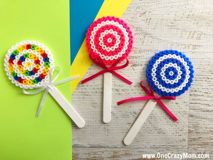 Perler bead crafts are so much fun and we have over 15 easy perler bead ideas. Choose from picture frames, magnets and so much more. Perler Bead lollipops together.