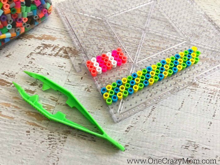 The pattern being made with the beads. 