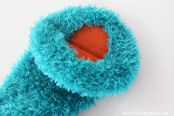 Learn how to make a hand puppet! It's very simple to make this diy sock puppet. Kids will love this easy diy hand puppet. Once you know how to make a sock puppet, it's so much fun! Make different puppets and have a puppet show! Sock Puppet with mouth inserted.