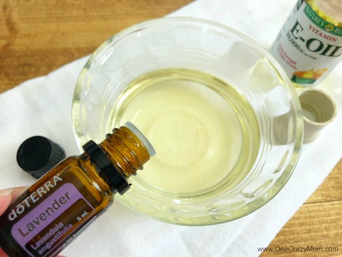 Learn how to make makeup remover. With only 3 ingredients, you will have the best eye makeup remover! This diy makeup remover is quick and easy. Try the best makeup remover. Lavender oil going into bowl.