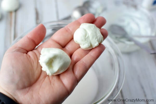 Kids are going to love these fun DIY Bouncy Balls. Learn how to make a bouncy ball! Glow in the dark bouncy balls are so cool! Once you know how to make bouncy balls, it's so simple and fun to do! Mixture broken into 2 mounds.