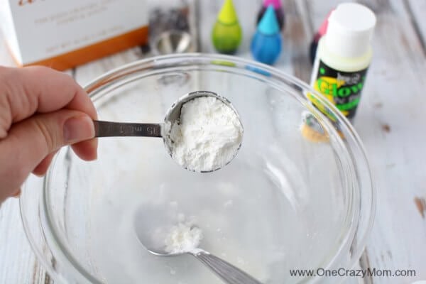 Kids are going to love these fun DIY Bouncy Balls. Learn how to make a bouncy ball! Glow in the dark bouncy balls are so cool! Once you know how to make bouncy balls, it's so simple and fun to do! Bowl with borax powder being added.