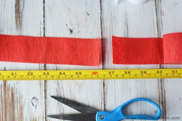 This DIY 4th of July wreath is made with crepe paper and takes very little time to make! Try this Fourth of July wreath with dollar store supplies! This DIY 4th of July wreath is made with crepe paper and takes very little time to make! Try this Fourth of July wreath with dollar store supplies!