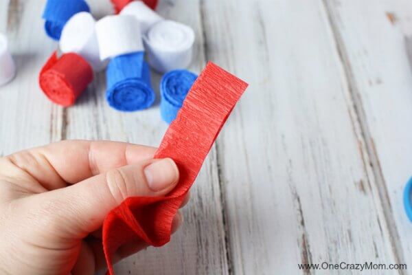 This DIY 4th of July wreath is made with crepe paper and takes very little time to make! Try this Fourth of July wreath with dollar store supplies! This DIY 4th of July wreath is made with crepe paper and takes very little time to make! Try this Fourth of July wreath with dollar store supplies!