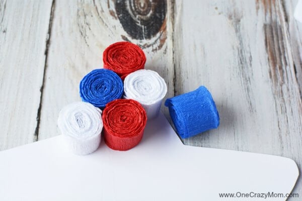 This DIY 4th of July wreath is made with crepe paper and takes very little time to make! Try this Fourth of July wreath with dollar store supplies! This DIY 4th of July wreath is made with crepe paper and takes very little time to make! Try this Fourth of July wreath with dollar store supplies!