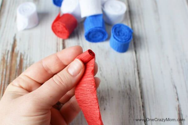 This DIY 4th of July wreath is made with crepe paper and takes very little time to make! Try this Fourth of July wreath with dollar store supplies! This DIY 4th of July wreath is made with crepe paper and takes very little time to make! Try this Fourth of July wreath with dollar store supplies!