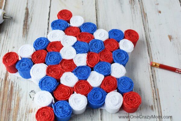 This DIY 4th of July wreath is made with crepe paper and takes very little time to make! Try this Fourth of July wreath with dollar store supplies! This DIY 4th of July wreath is made with crepe paper and takes very little time to make! Try this Fourth of July wreath with dollar store supplies!