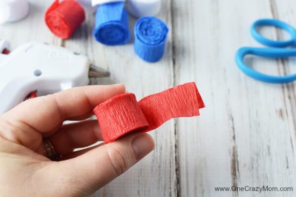 This DIY 4th of July wreath is made with crepe paper and takes very little time to make! Try this Fourth of July wreath with dollar store supplies! This DIY 4th of July wreath is made with crepe paper and takes very little time to make! Try this Fourth of July wreath with dollar store supplies!