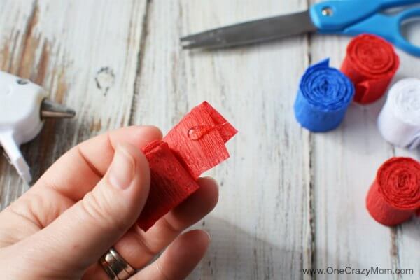 This DIY 4th of July wreath is made with crepe paper and takes very little time to make! Try this Fourth of July wreath with dollar store supplies! This DIY 4th of July wreath is made with crepe paper and takes very little time to make! Try this Fourth of July wreath with dollar store supplies!