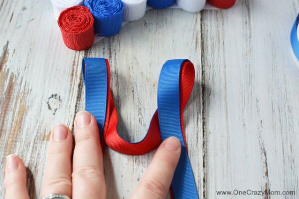 This DIY 4th of July wreath is made with crepe paper and takes very little time to make! Try this Fourth of July wreath with dollar store supplies! This DIY 4th of July wreath is made with crepe paper and takes very little time to make! Try this Fourth of July wreath with dollar store supplies!