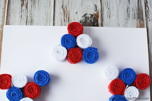 This DIY 4th of July wreath is made with crepe paper and takes very little time to make! Try this Fourth of July wreath with dollar store supplies! This DIY 4th of July wreath is made with crepe paper and takes very little time to make! Try this Fourth of July wreath with dollar store supplies!