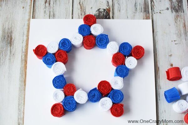 This DIY 4th of July wreath is made with crepe paper and takes very little time to make! Try this Fourth of July wreath with dollar store supplies! This DIY 4th of July wreath is made with crepe paper and takes very little time to make! Try this Fourth of July wreath with dollar store supplies!