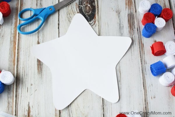 This DIY 4th of July wreath is made with crepe paper and takes very little time to make! Try this Fourth of July wreath with dollar store supplies! This DIY 4th of July wreath is made with crepe paper and takes very little time to make! Try this Fourth of July wreath with dollar store supplies!