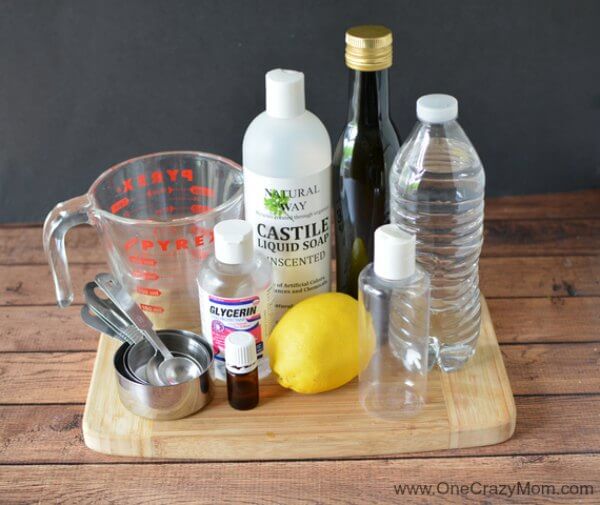 DIY clarifying shampoo helps remove build up from water, styling product residue and chlorine. Learn how to make Clarifying Shampoo that is all natural. Ingredients for clarifying shampoo - castile soap, purified water, glycerin, lemon, olive oil, lemon essential oil.
