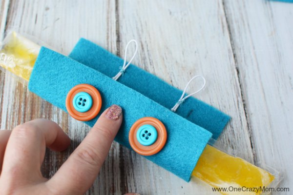 Learn how to make a DIY popsicle holder. It is so simple to make a homemade popsicle sleeve. Kid's will love having their very own popsicle holder. Little hands will not get cold using a homemade popsicle holder. They are so easy to make and budget friendly! Learn how to make a DIY popsicle holder. It is so simple to make a homemade popsicle sleeve. Kid's will love having their very own popsicle holder. Little hands will not get cold using a homemade popsicle holder. They are so easy to make and budget friendly!