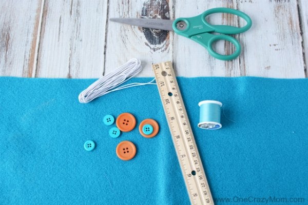 Learn how to make a DIY popsicle holder. It is so simple to make a homemade popsicle sleeve. Kid's will love having their very own popsicle holder. Little hands will not get cold using a homemade popsicle holder. They are so easy to make and budget friendly! Supplies for Child popsicle holder.