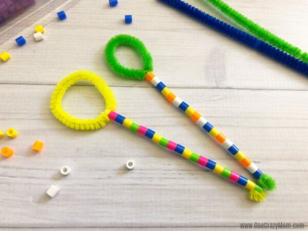Learn how to make a bubble wand. Make this diy bubble wand for tons of fun. Homemade bubble wands are easy to make. Kids will love decorating the wands with beads. Bubble Wands ready to use.