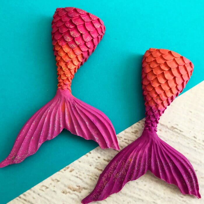 Learn how to make crayons shaped like mermaid tails! These are perfect for a mermaid birthday party. It's so easy once you know how to make crayons. Try these fun mermaid tails crayons. Kid's will love all the glitter! They are so pretty! Mermaid crayons ready to use.