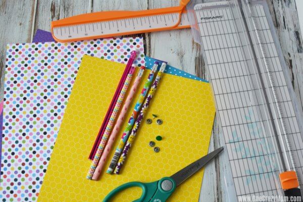 Learn how to make paper pinwheels. It's so easy to make paper pinwheels. Once you know how to make a paper pinwheel, it's very simple. Paper pinwheels DIY! Supplies for pinwheels- decorative paper, scissors, paper trimmer, pencils, push pins, glue, ruler.
