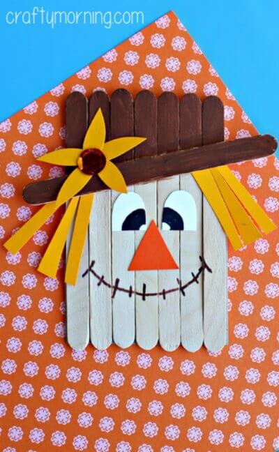 Over 15 of the best Fall Crafts for Kids - Quick and Easy crafts for toddlers - Fall Crafts for toddlers and more. Easy DIY fall crafts everyone will love! #onecrazymom #craftideas #kidscrafts #fall Popsicle Stick scarecrow craft completed.