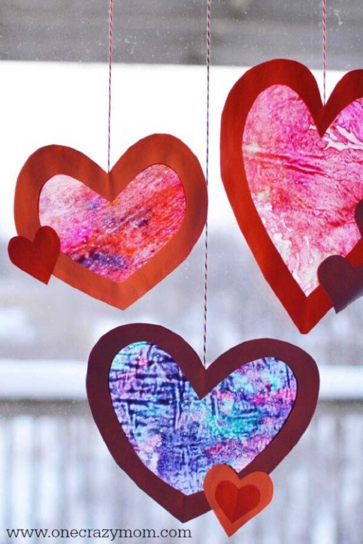Let the kids make homemade suncatchers for the perfect Valentine's Day Craft. They will love this heart suncatcher and it's so simple to make. Let the kids make homemade suncatchers for the perfect Valentine's Day Craft. They will love this heart suncatcher and it's so simple to make.