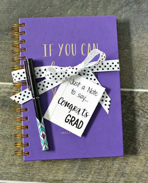 We have the best Graduation Party Ideas. You will find a big list of decor ideas, party food recipes, gifts and more to make your party a success. Journal with pen tied with a ribbon.
