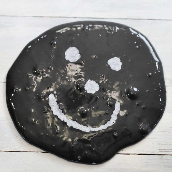 If your kids are crazy over slime, they are going to love to learn how to make Chalkboard Slime! Take slime to the next level with this chalk slime recipe. Slime with smiley face.