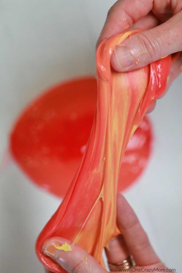 Slime being stretched and played with.