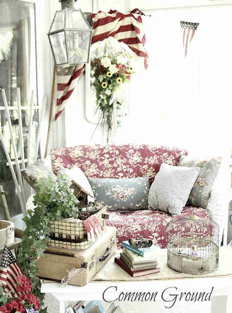 Vintage couch and porch decor with books.