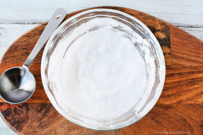 Mixing bowl with baking soda and water combined into a paste. 